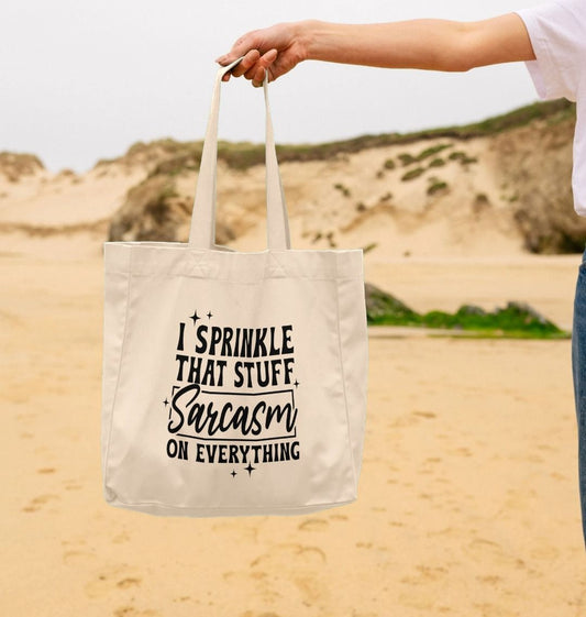 White tote bag with "I sprinkle that stuff on everything" text (person)