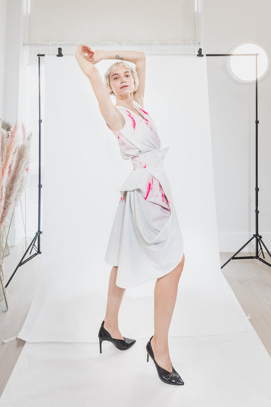 Asymmetrical white dress with pink floral pattern (person)