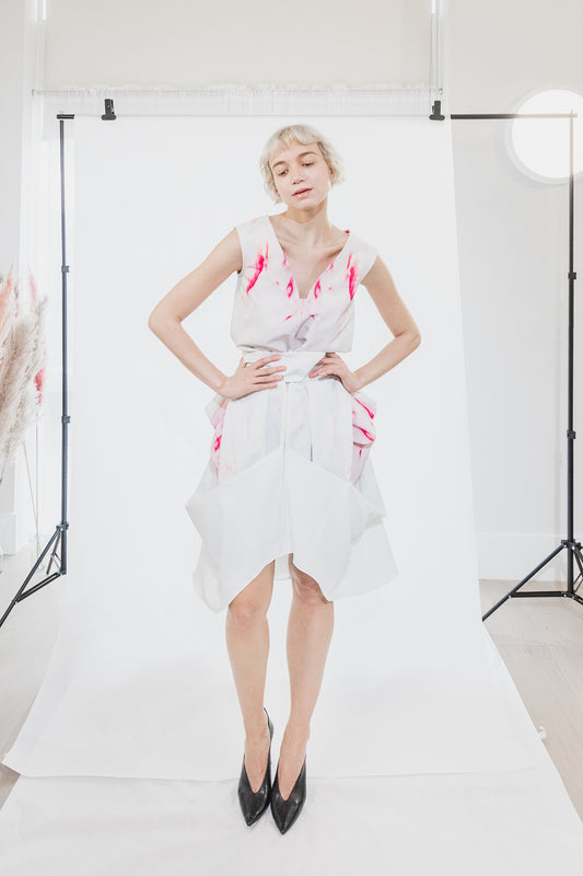 Asymmetric white dress with red floral pattern (person)