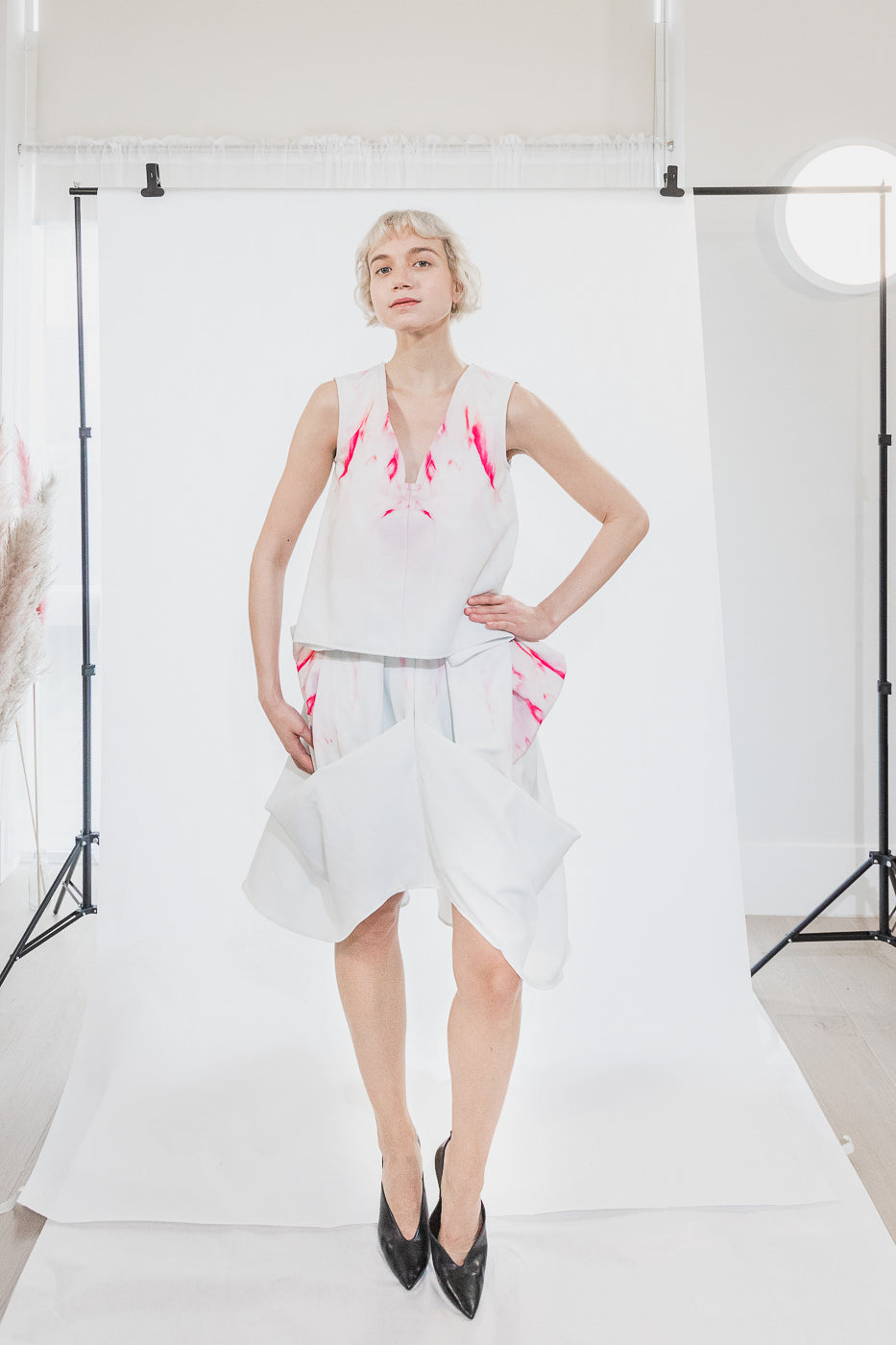 White dress with red splatter design (person)