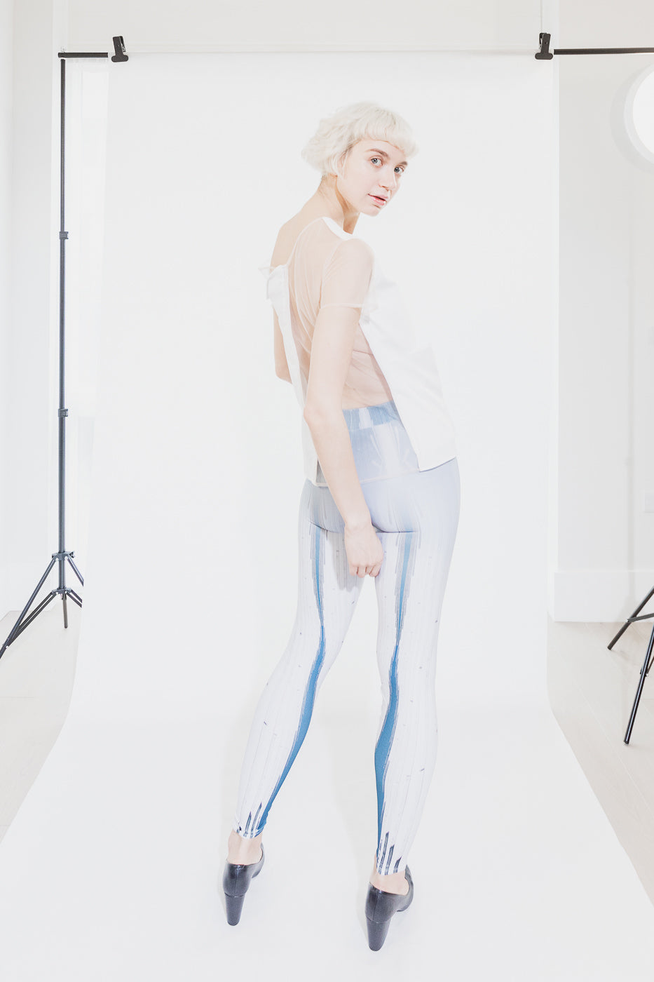 White and blue patterned leggings with sheer top (person)