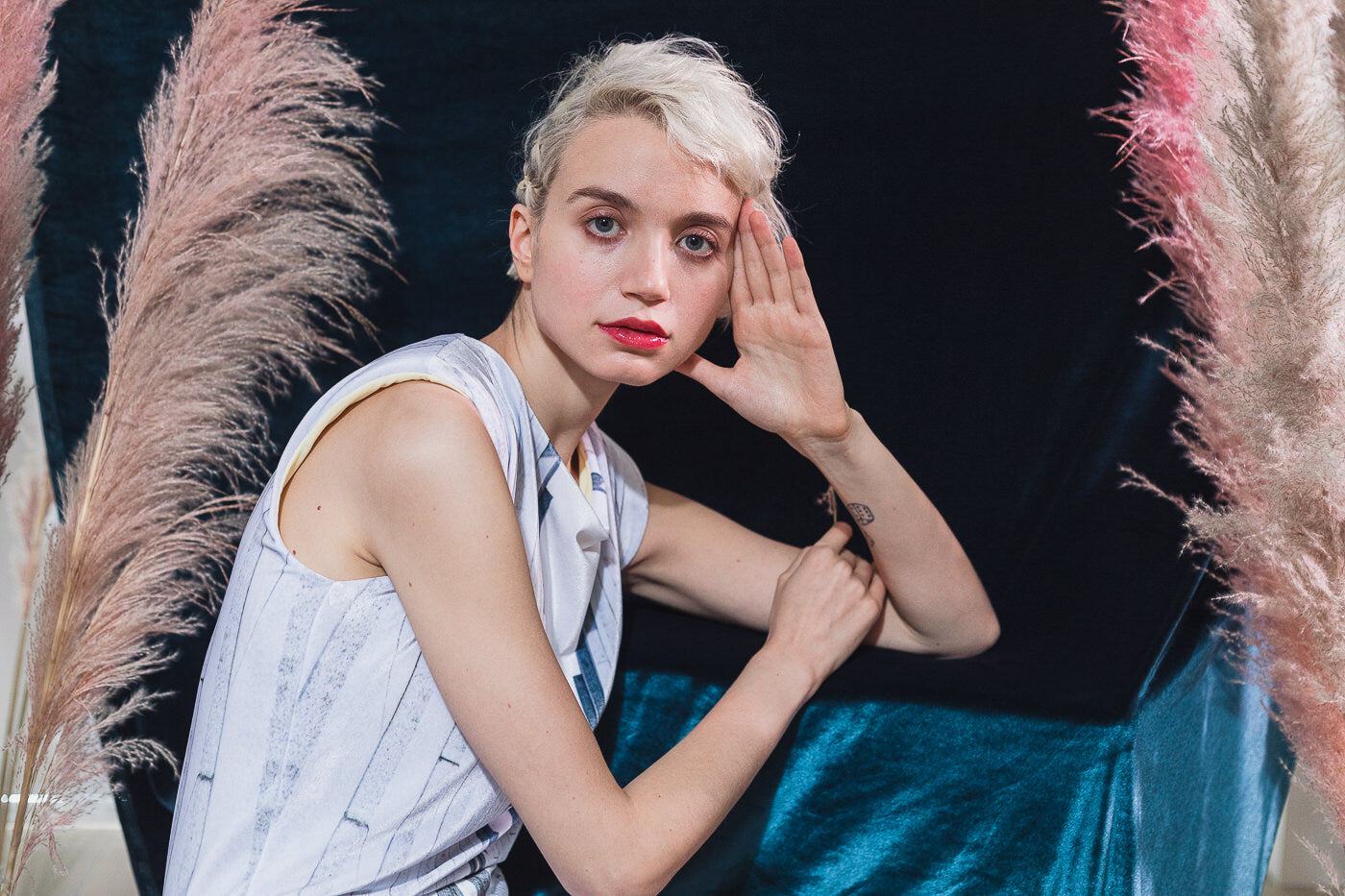 White sleeveless top with abstract pattern (person)