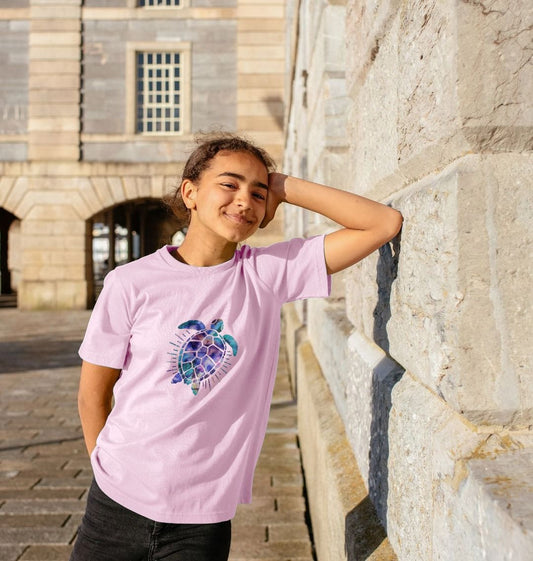 Pink t-shirt with turtle graphic (person)