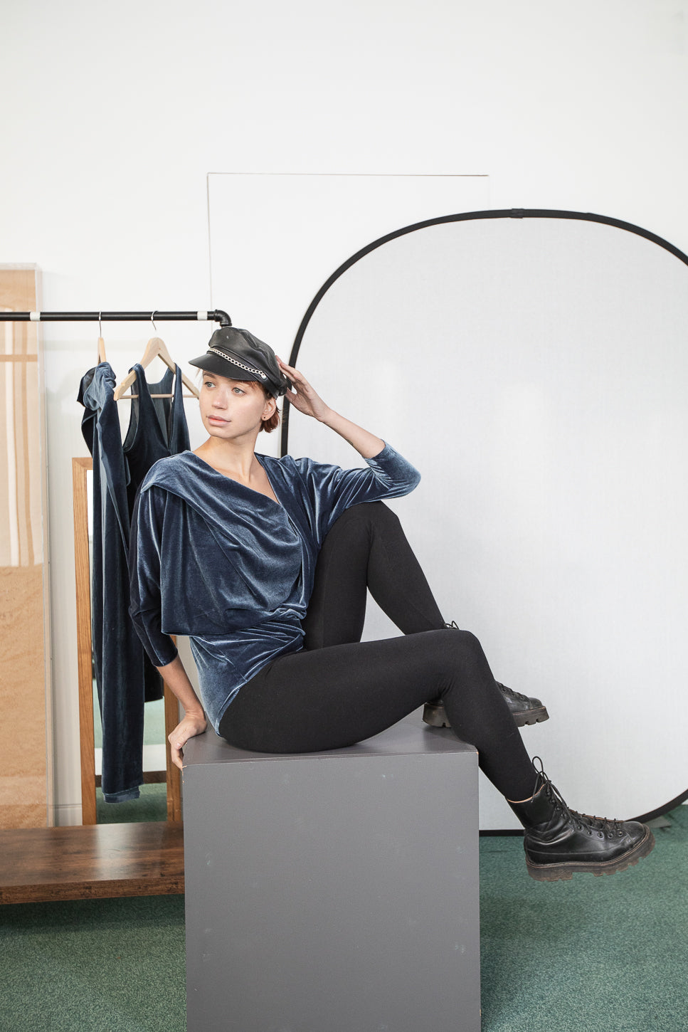 Velvet top with black leggings and boots (person)