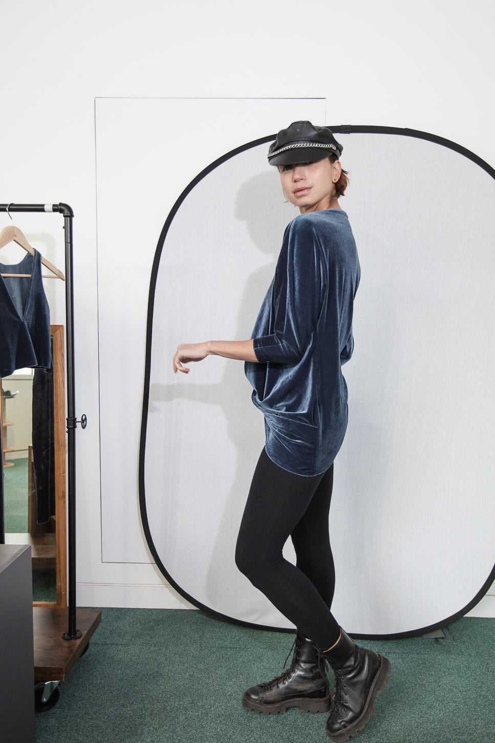 Velvet long-sleeve top with black leggings and boots (person)