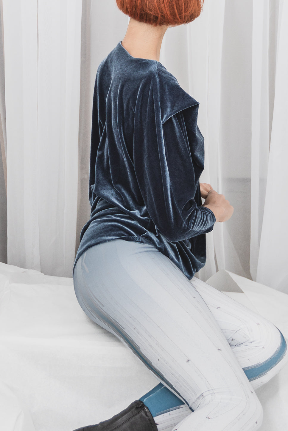 Blue velvet long-sleeve top with high-waisted leggings (person)