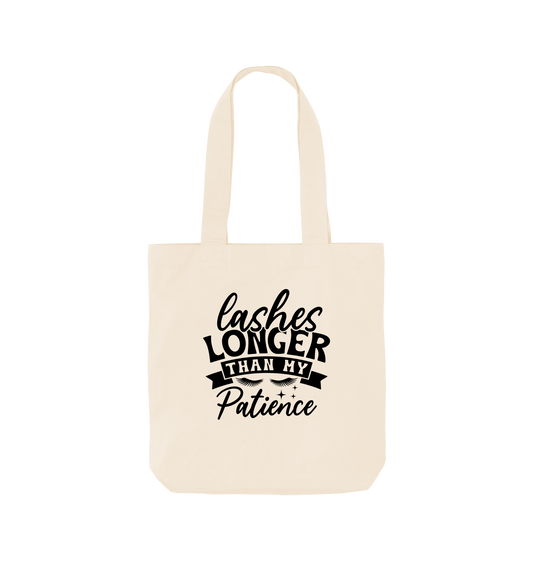 White tote bag with "Lashes Longer Than My Patience" text