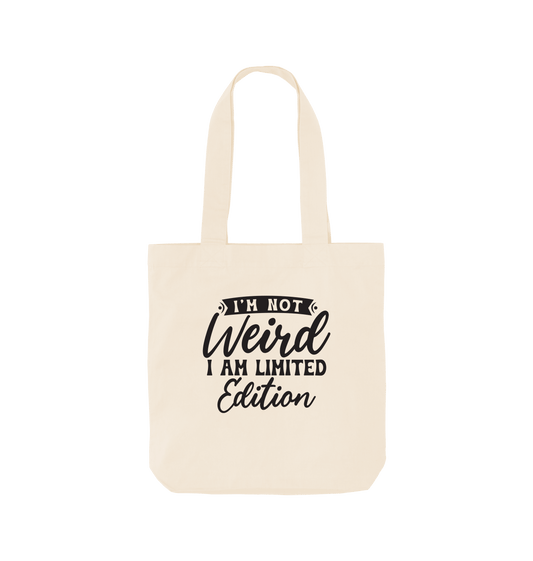 White tote bag with "I'm Not Weird, I Am Limited Edition" text