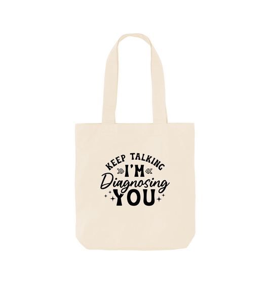 White tote bag with "Keep Talking I'm Diagnosing You" text