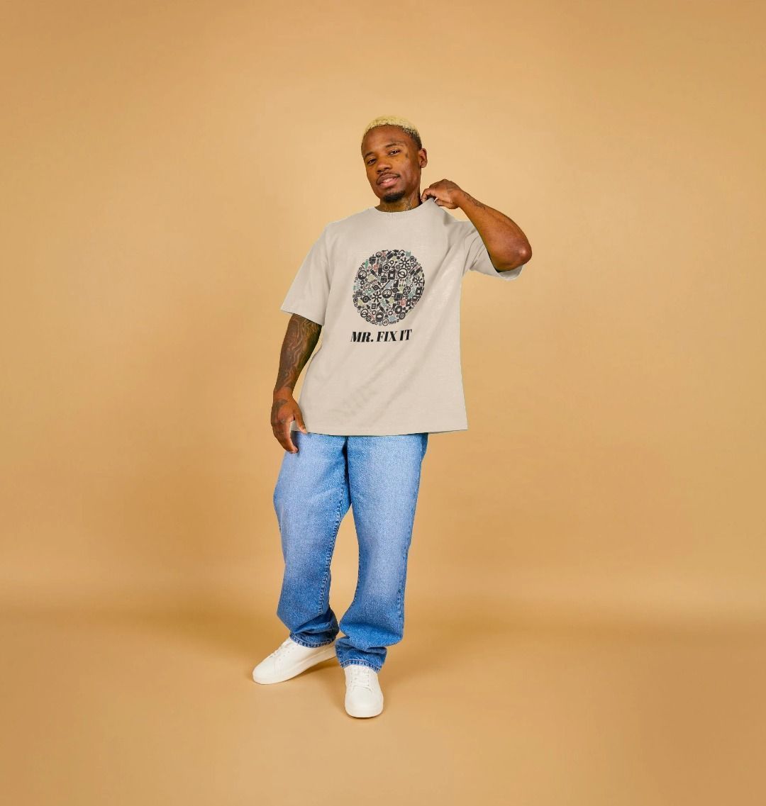 Oversized beige t-shirt with "Mr. Fix It" graphic (person)