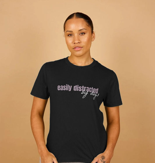Black t-shirt with "easily distracted by dogs" text (person)