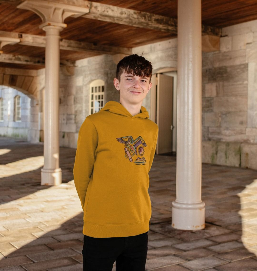 Mustard yellow hoodie with colorful graphic (person)