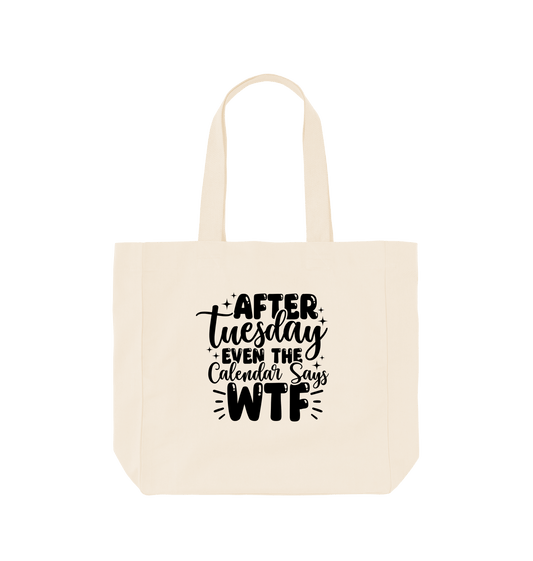 White tote bag with "After Tuesday Even the Calendar Says WTF" text