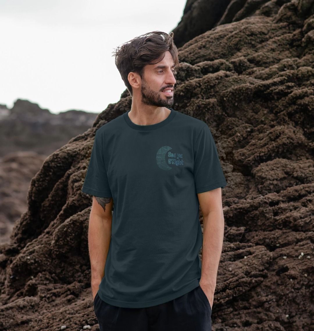 Dark green t-shirt with "Sea ya G'Night" logo (person)
