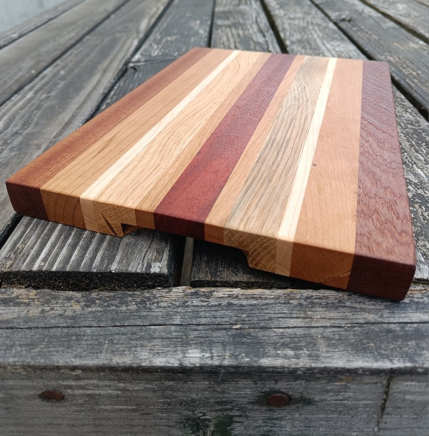 Wooden cutting board with striped design