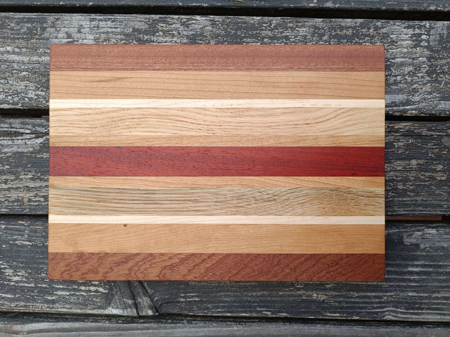 Wooden cutting board with striped design