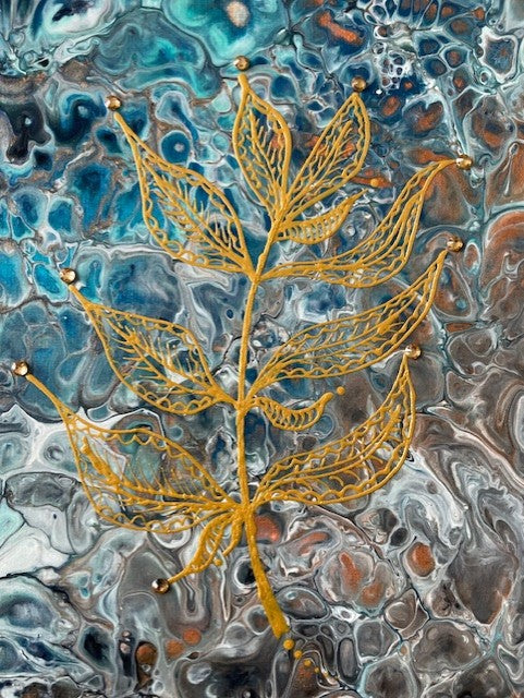 Intricate gold leaf design on abstract background