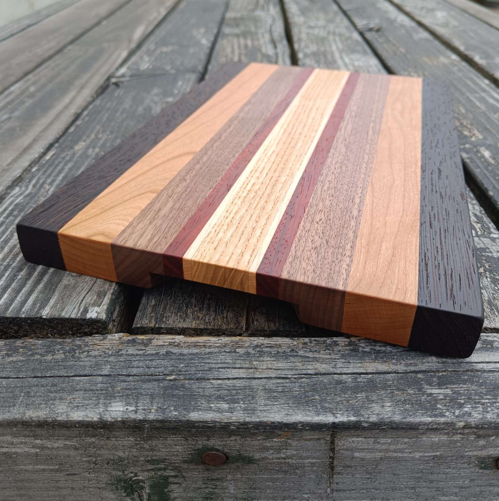 Wooden cutting board with striped design