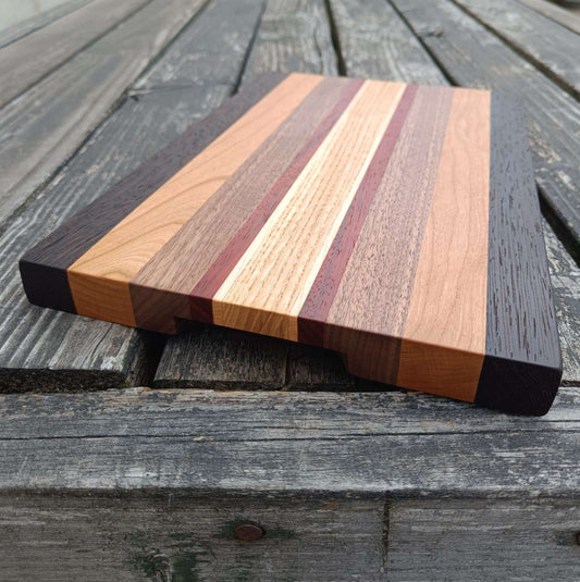 Wooden cutting board with striped design
