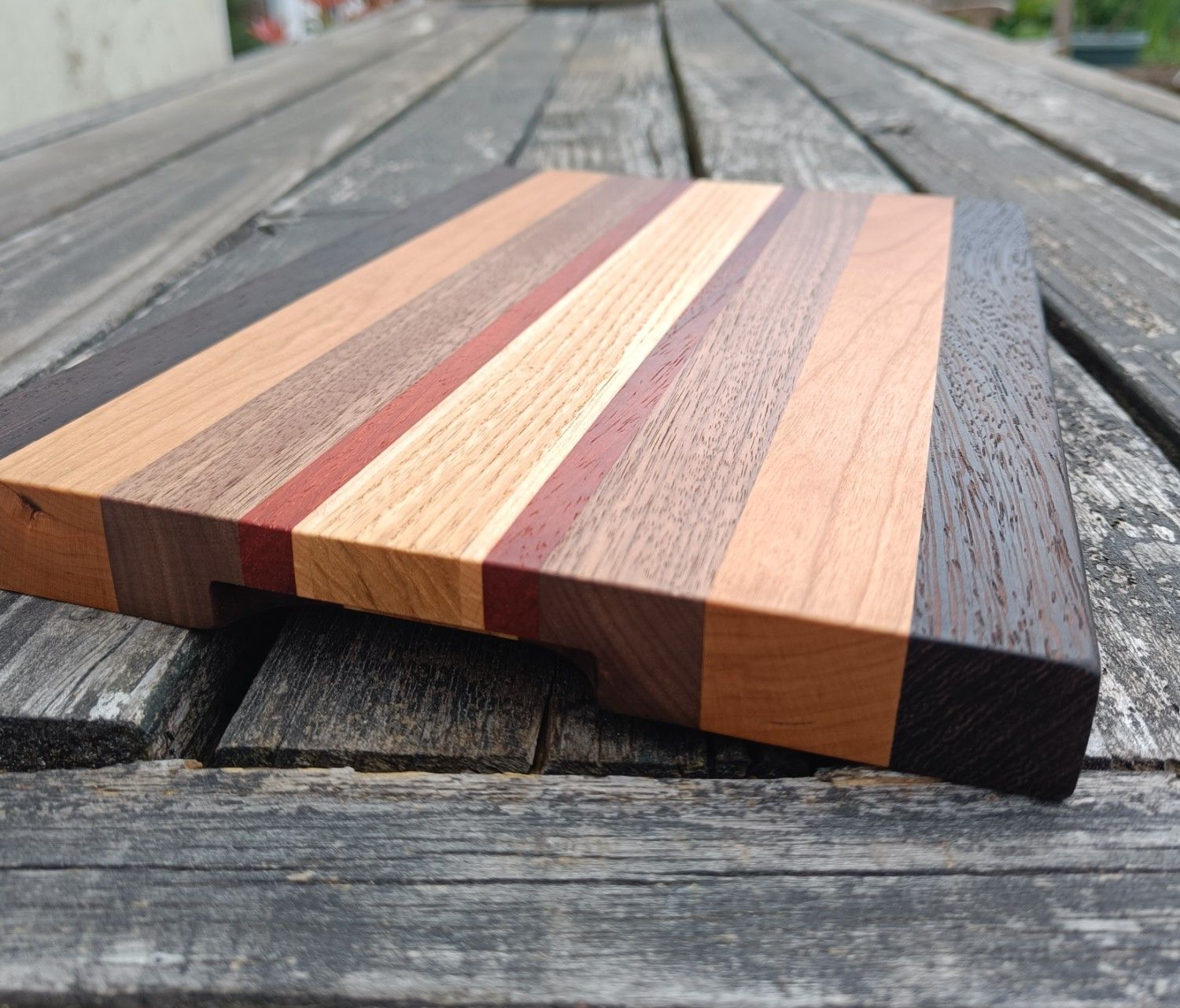 Wooden cutting board with striped design
