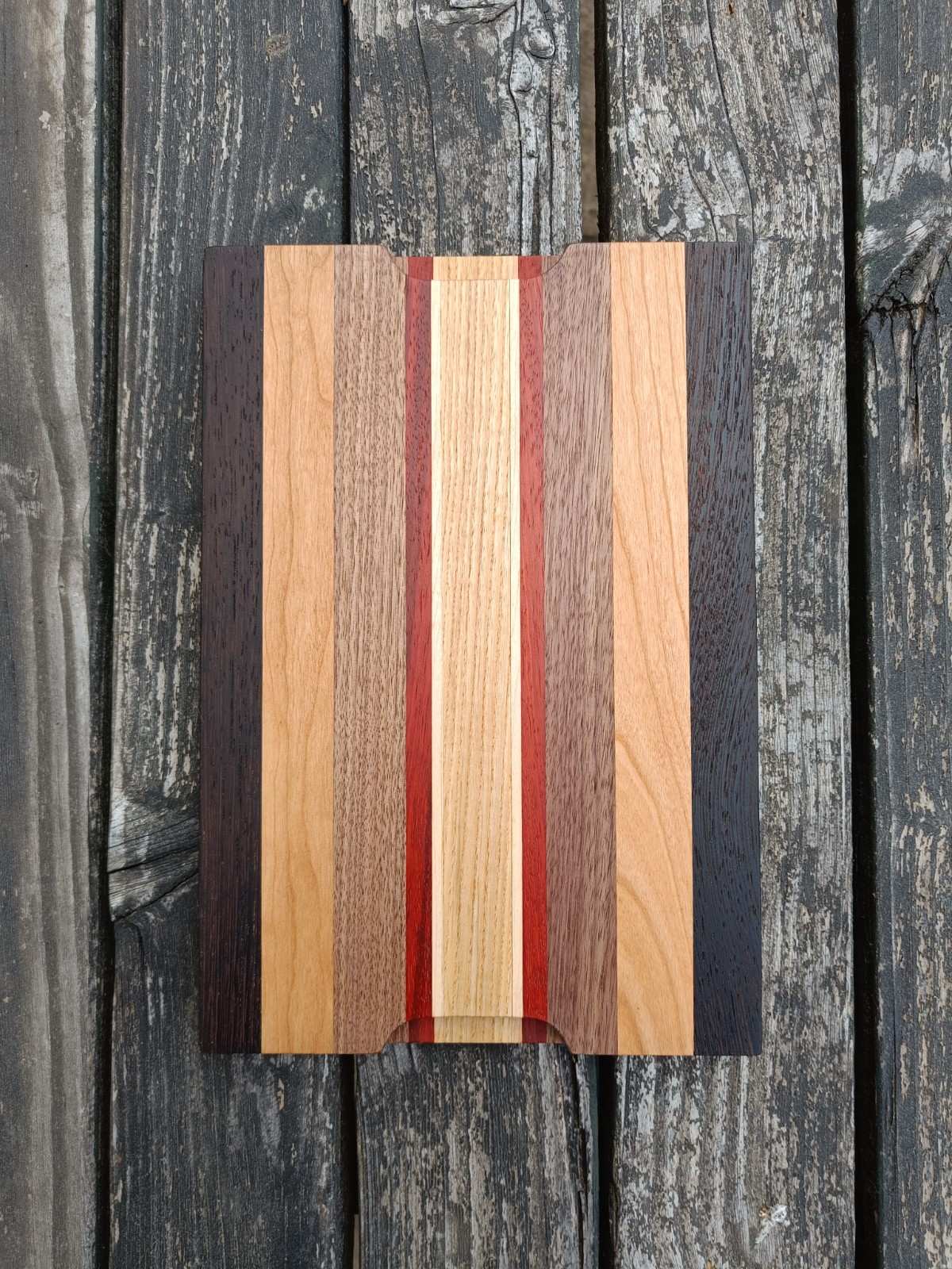 Wooden cutting board with striped design