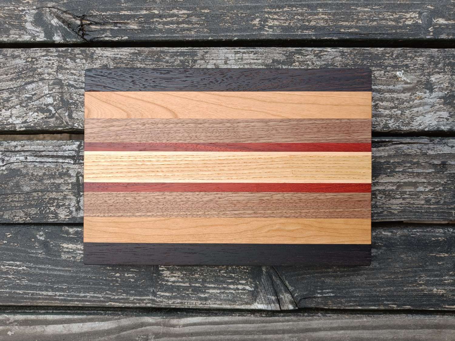 Wooden cutting board with striped design