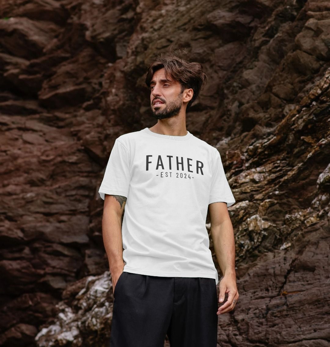 White t-shirt with "FATHER EST 2024" text (person)