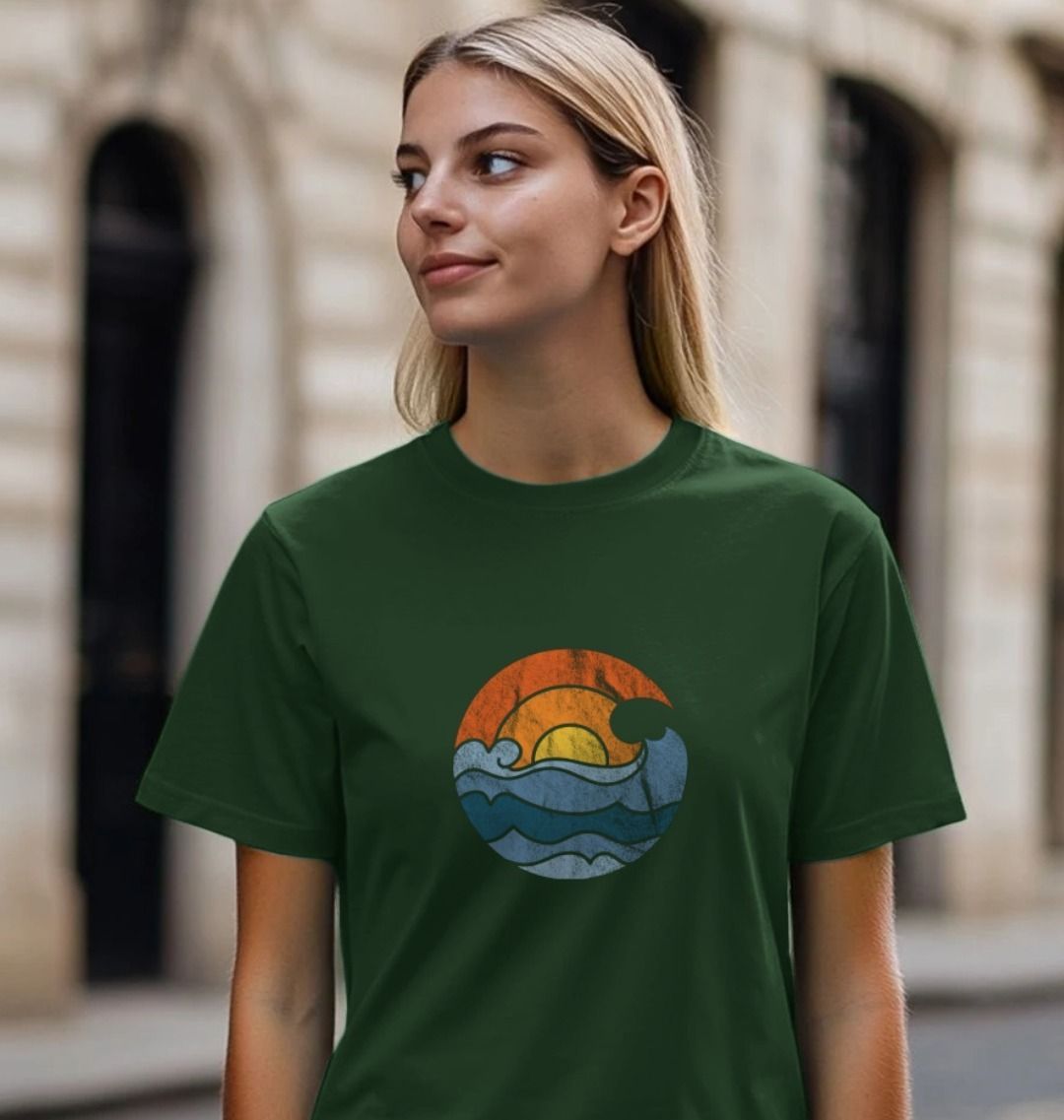 Forest green t-shirt with ocean wave design (person)