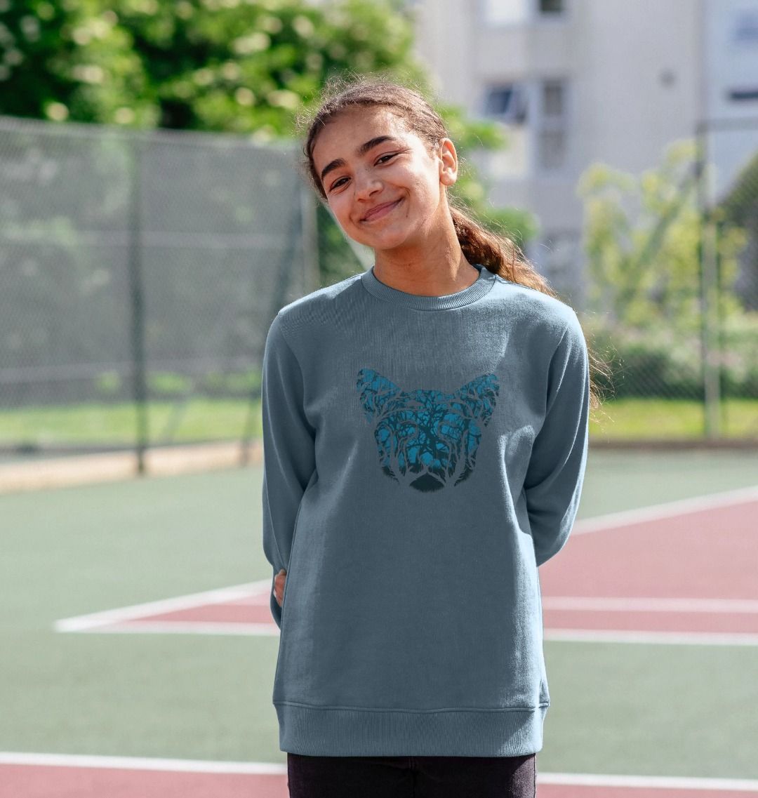 Blue sweatshirt with tree design (person)