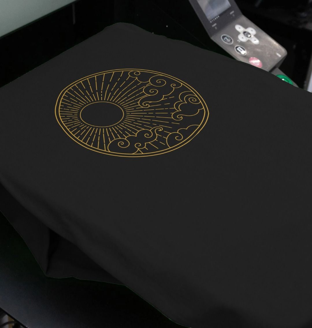Black t-shirt with gold circular design