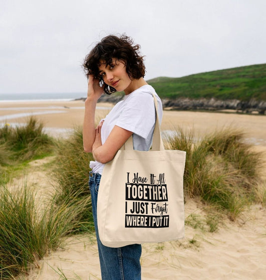White tote bag with text design (person)