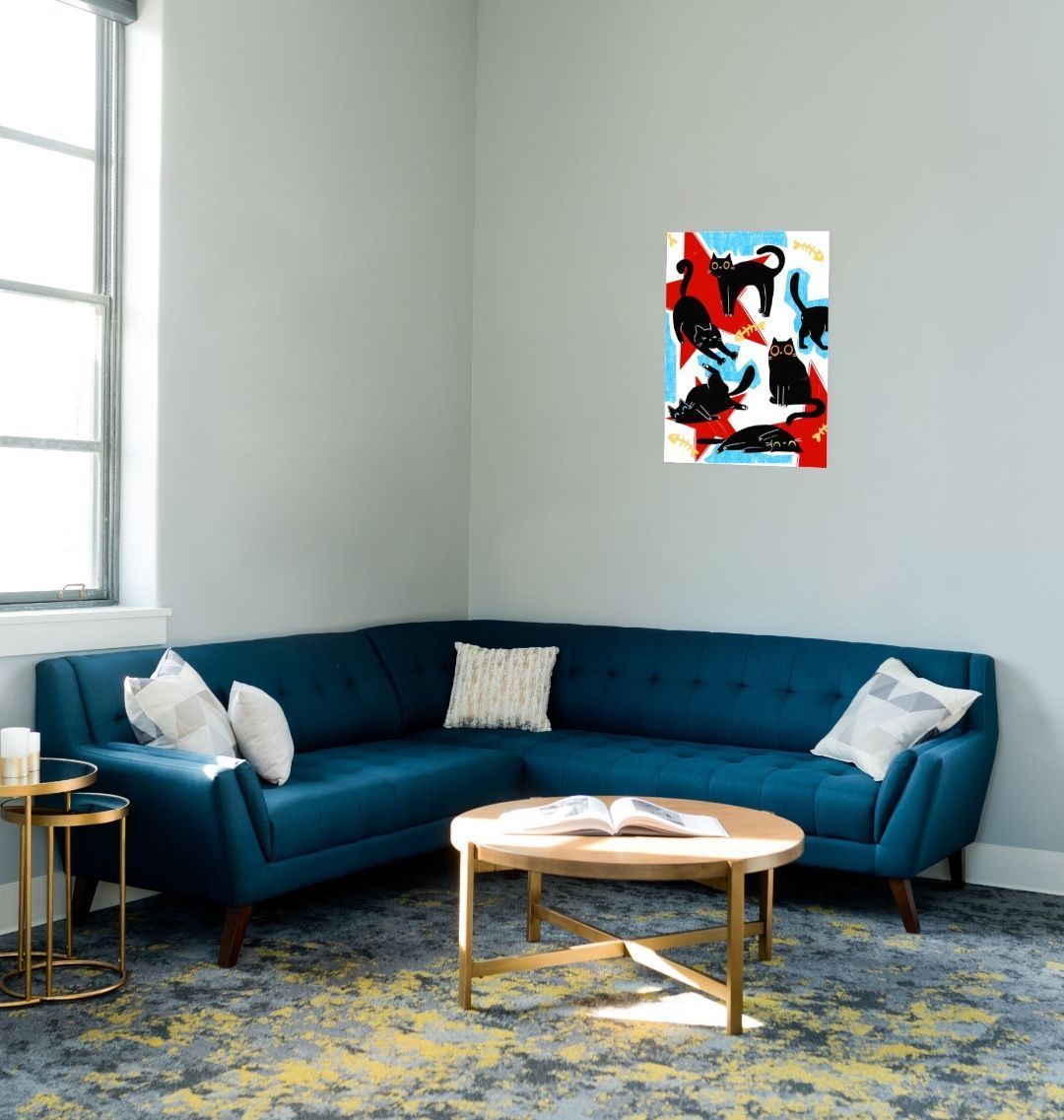 Blue sectional sofa with white and patterned pillows