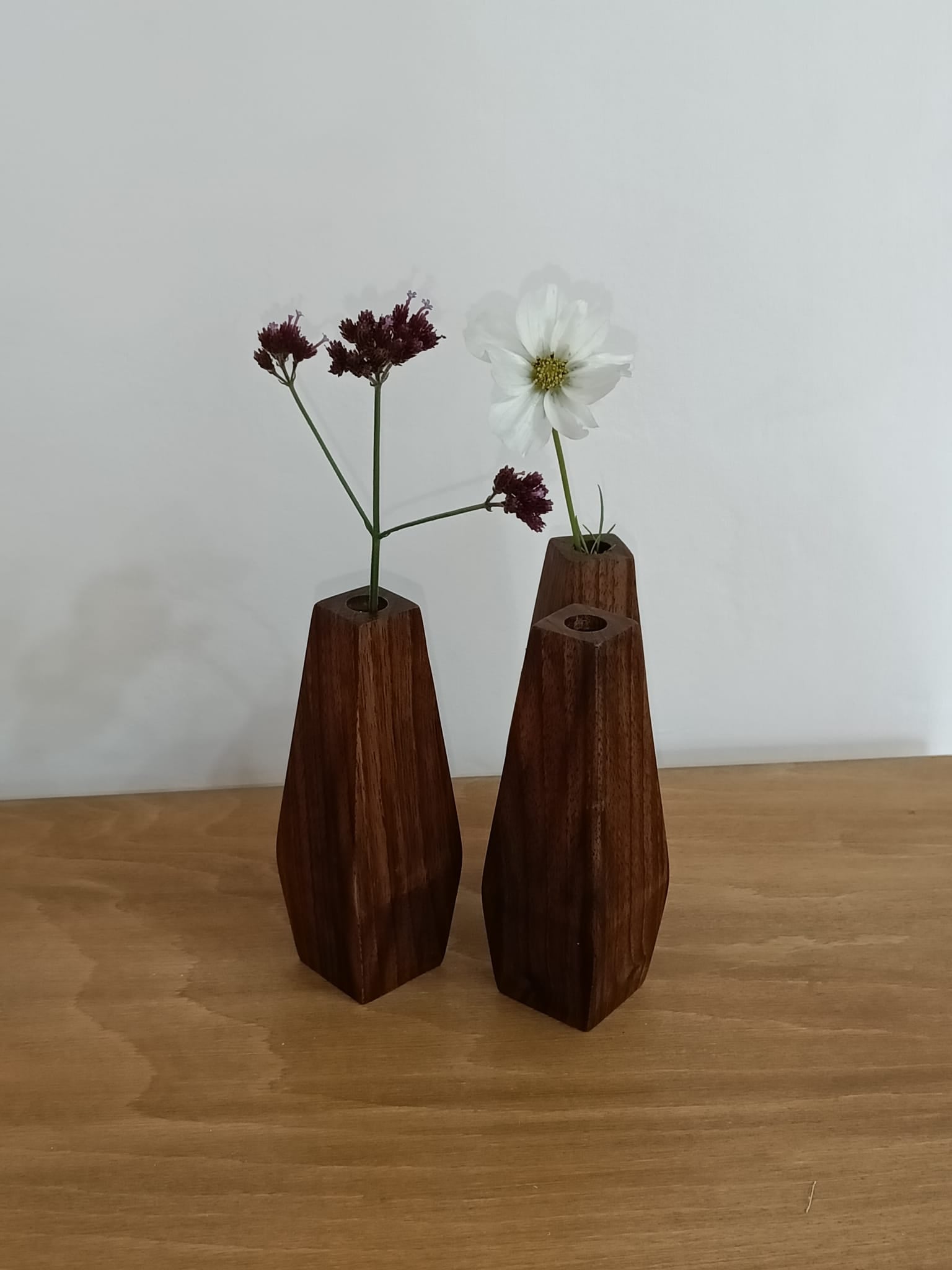 Two wooden vases with flowers