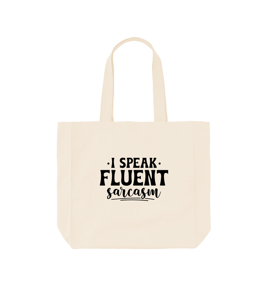 White canvas tote bag with "I SPEAK FLUENT sarcasm" text
