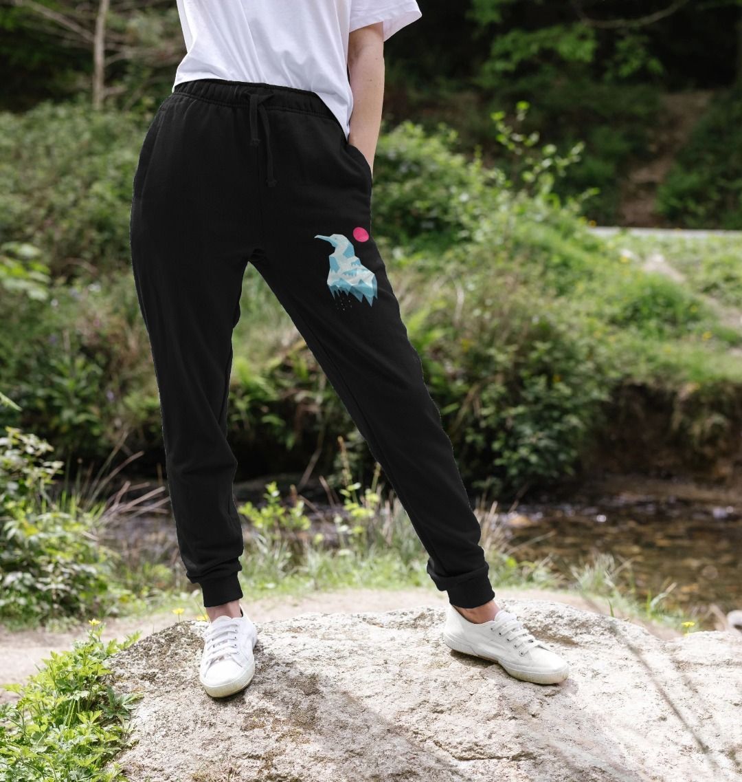Black jogger pants with bird design (person)