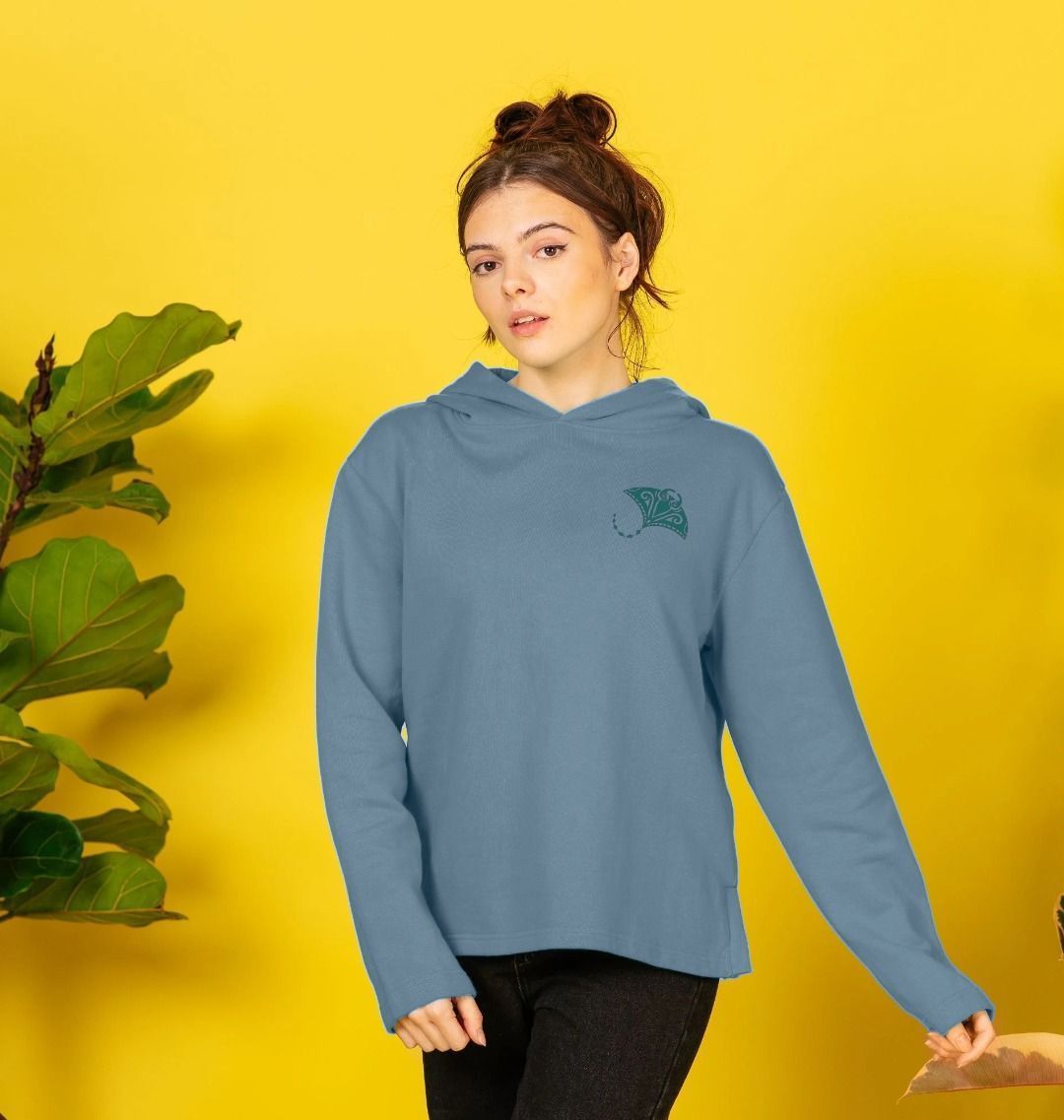 Blue hoodie with green embroidered design (person)