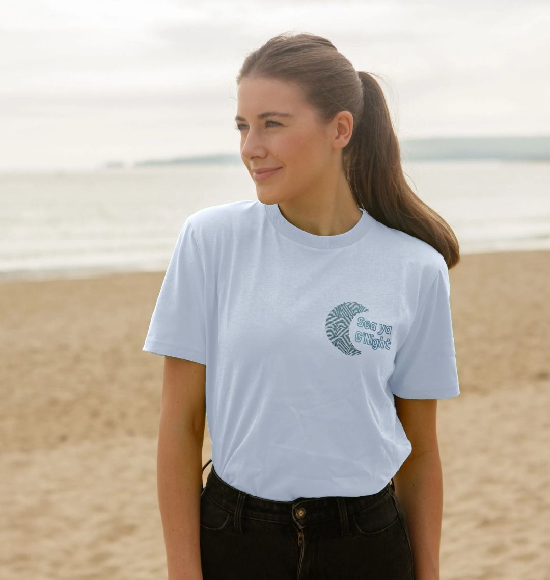 White t-shirt with "Sea ya G'Night" and crescent moon design (person)