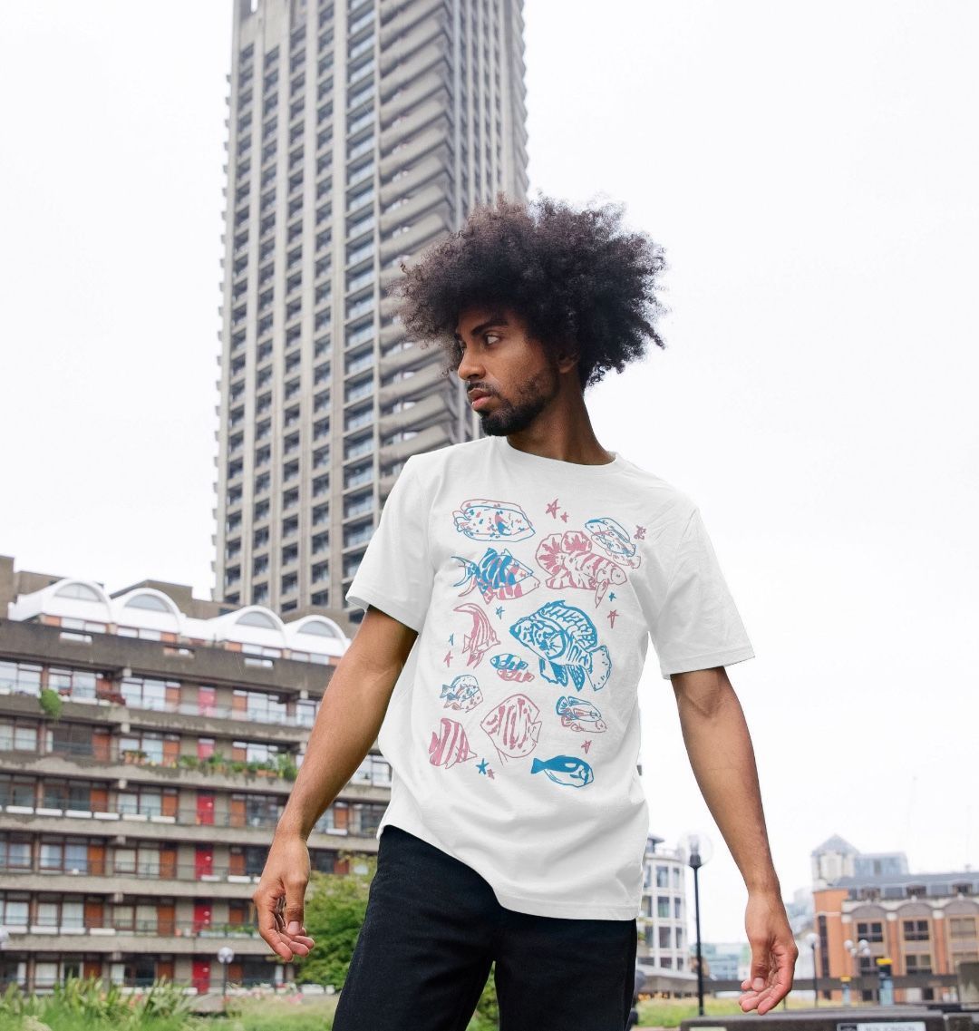 White t-shirt with colorful fish designs (person)