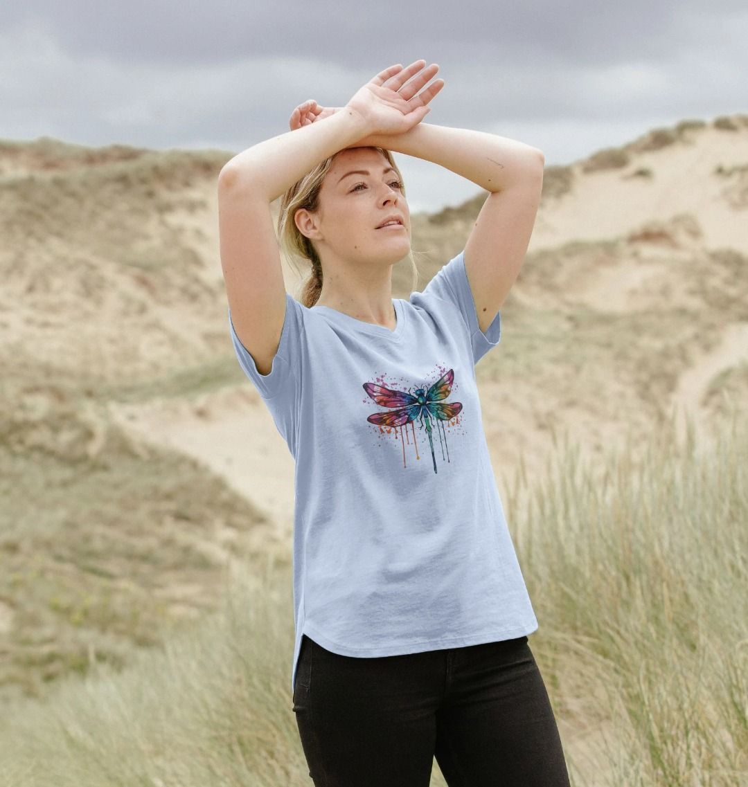 Light blue t-shirt with colorful dragonfly design (person)