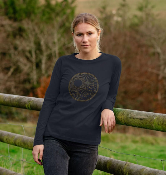 Black long-sleeved t-shirt with gold sun design (person)