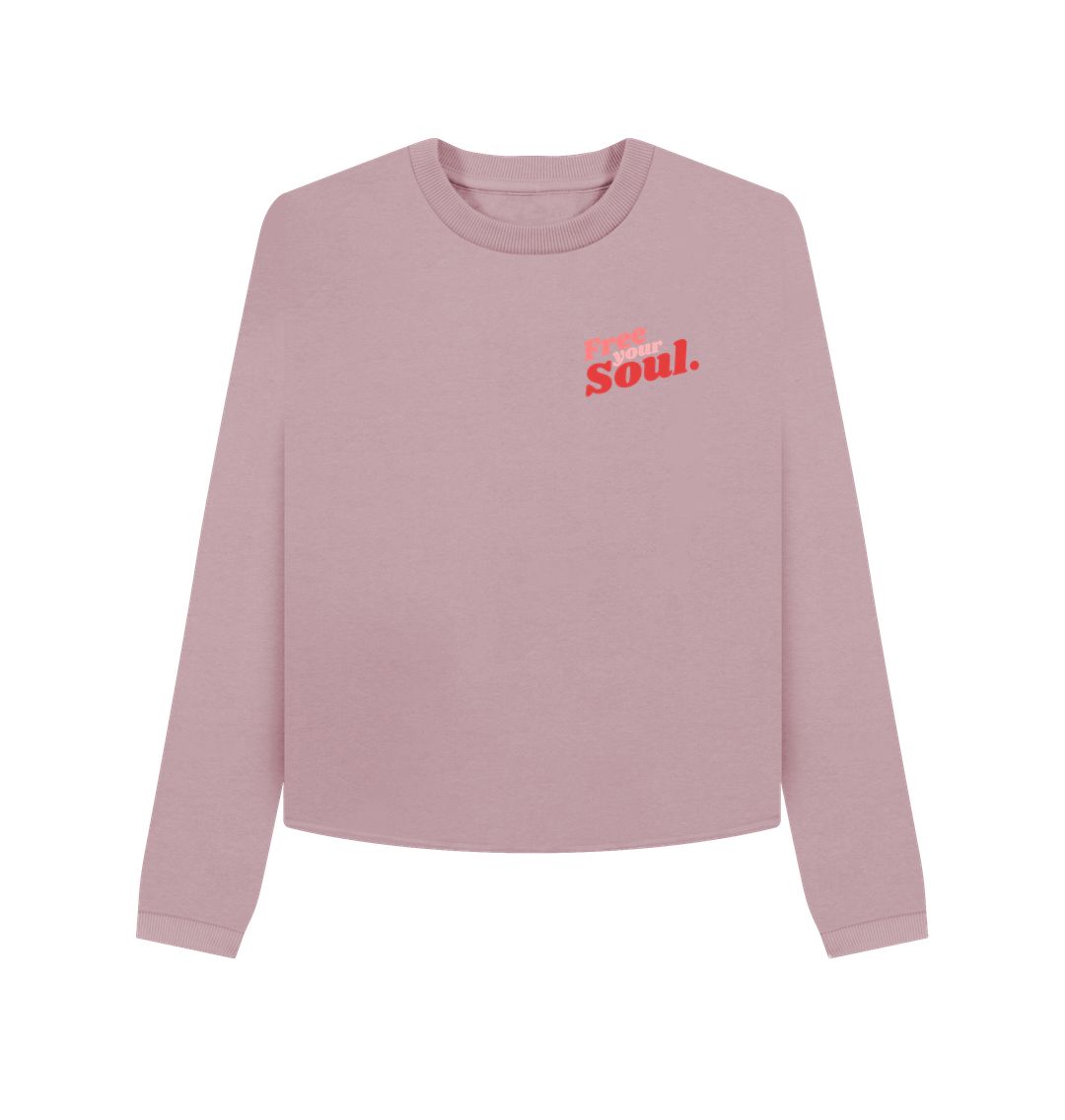 Pink long-sleeved sweatshirt with "Free Your Soul" text