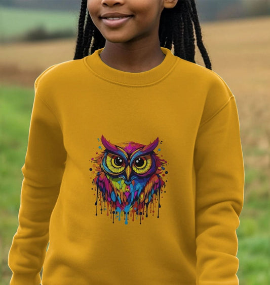 Yellow sweatshirt with colorful owl design (person)