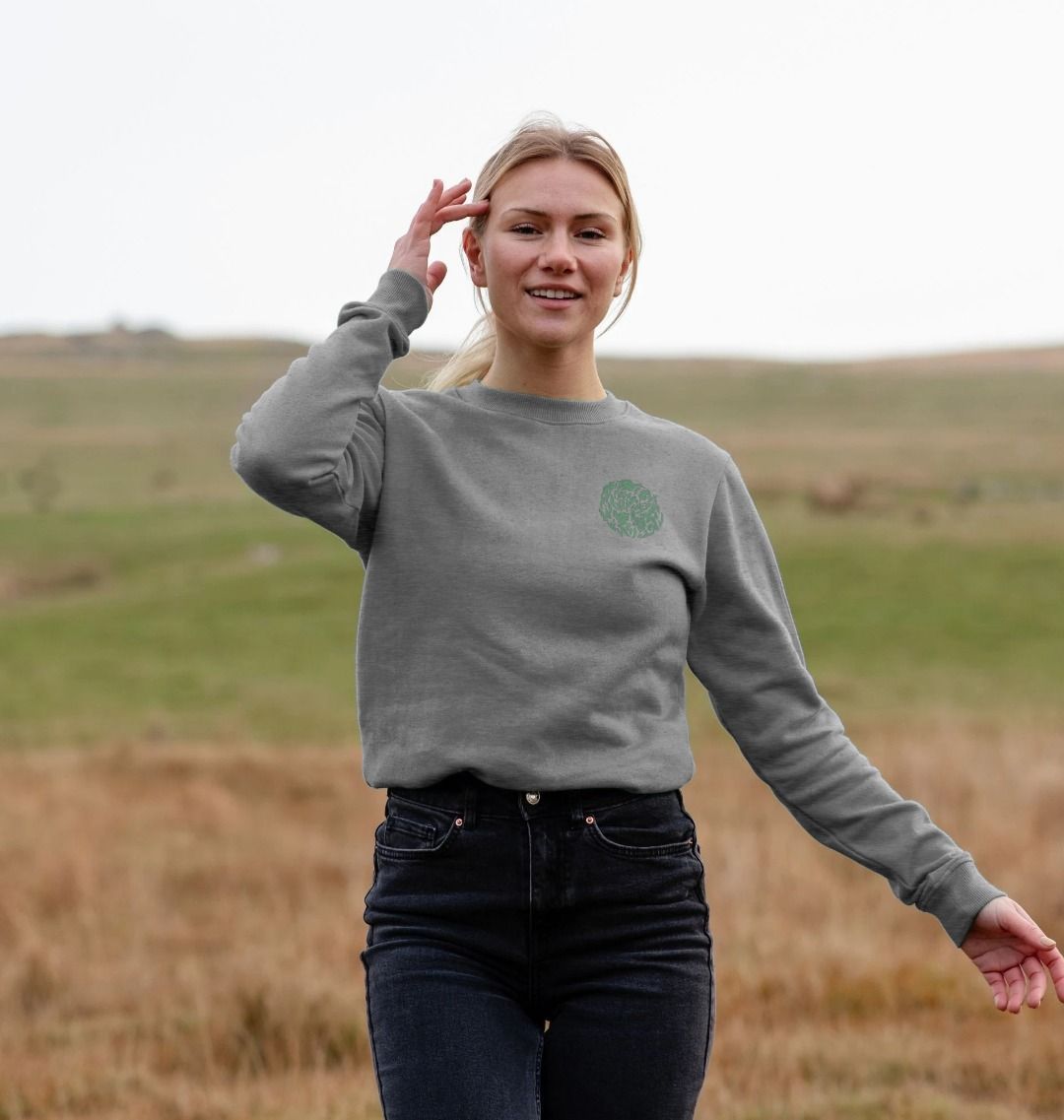 Grey sweatshirt with green logo (person)