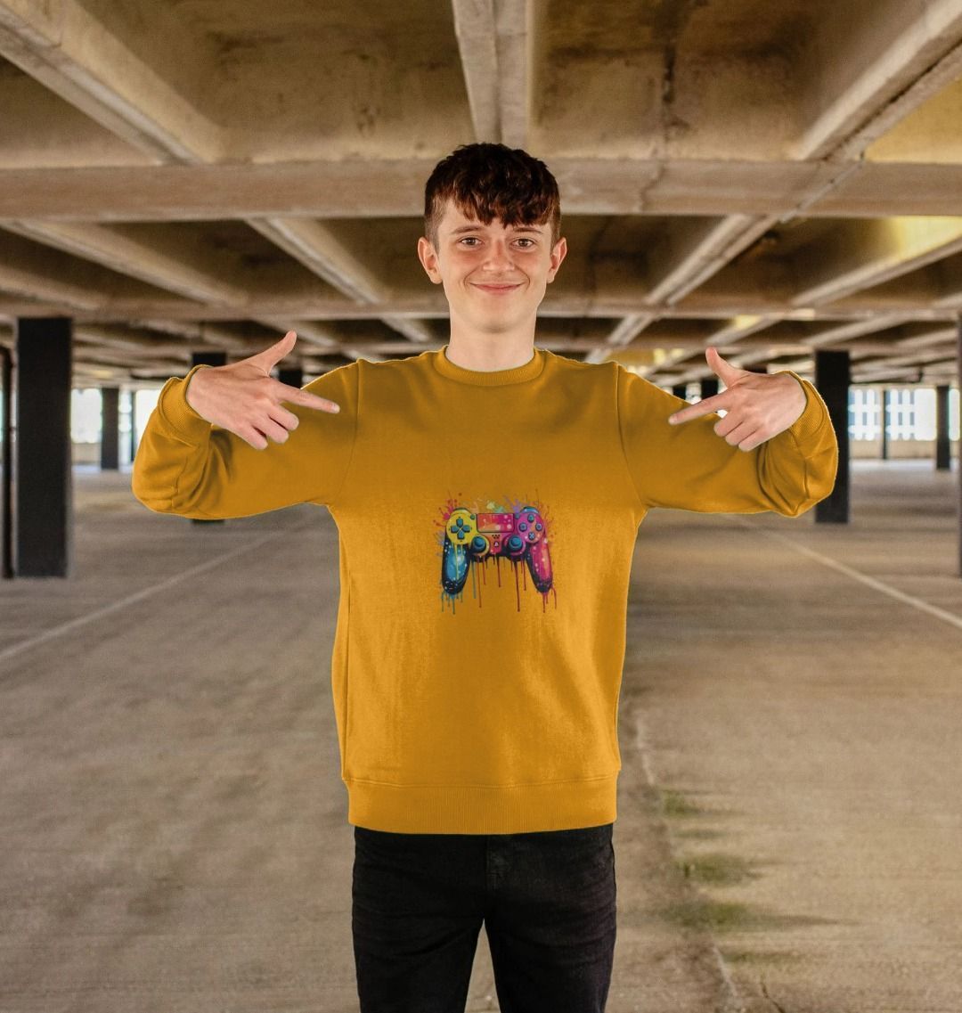 Yellow sweatshirt with colorful game controller design (person)