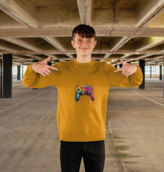 Yellow sweatshirt with colorful game controller design (person)