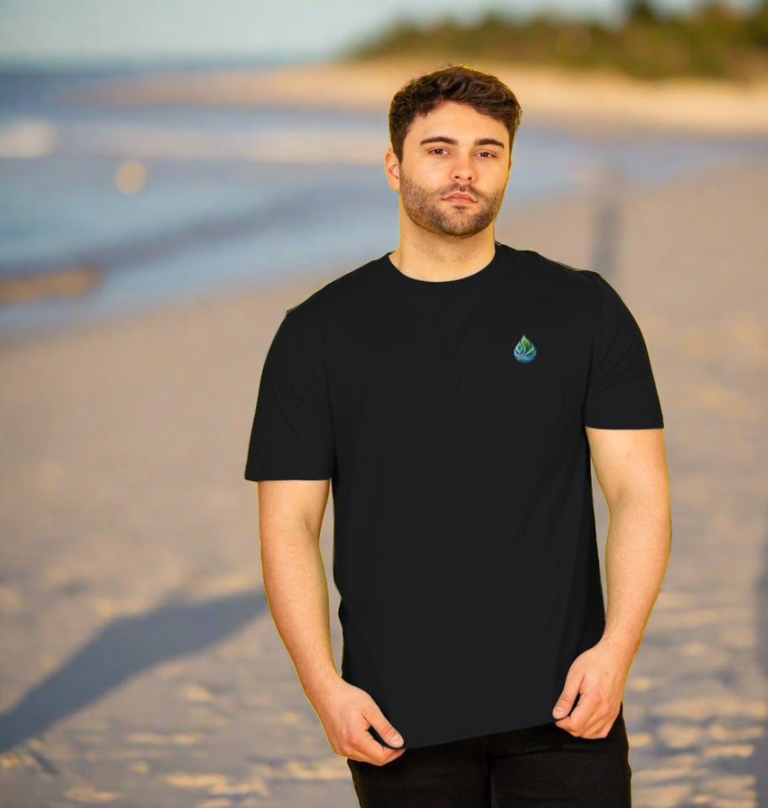 Black t-shirt with small green logo (person)
