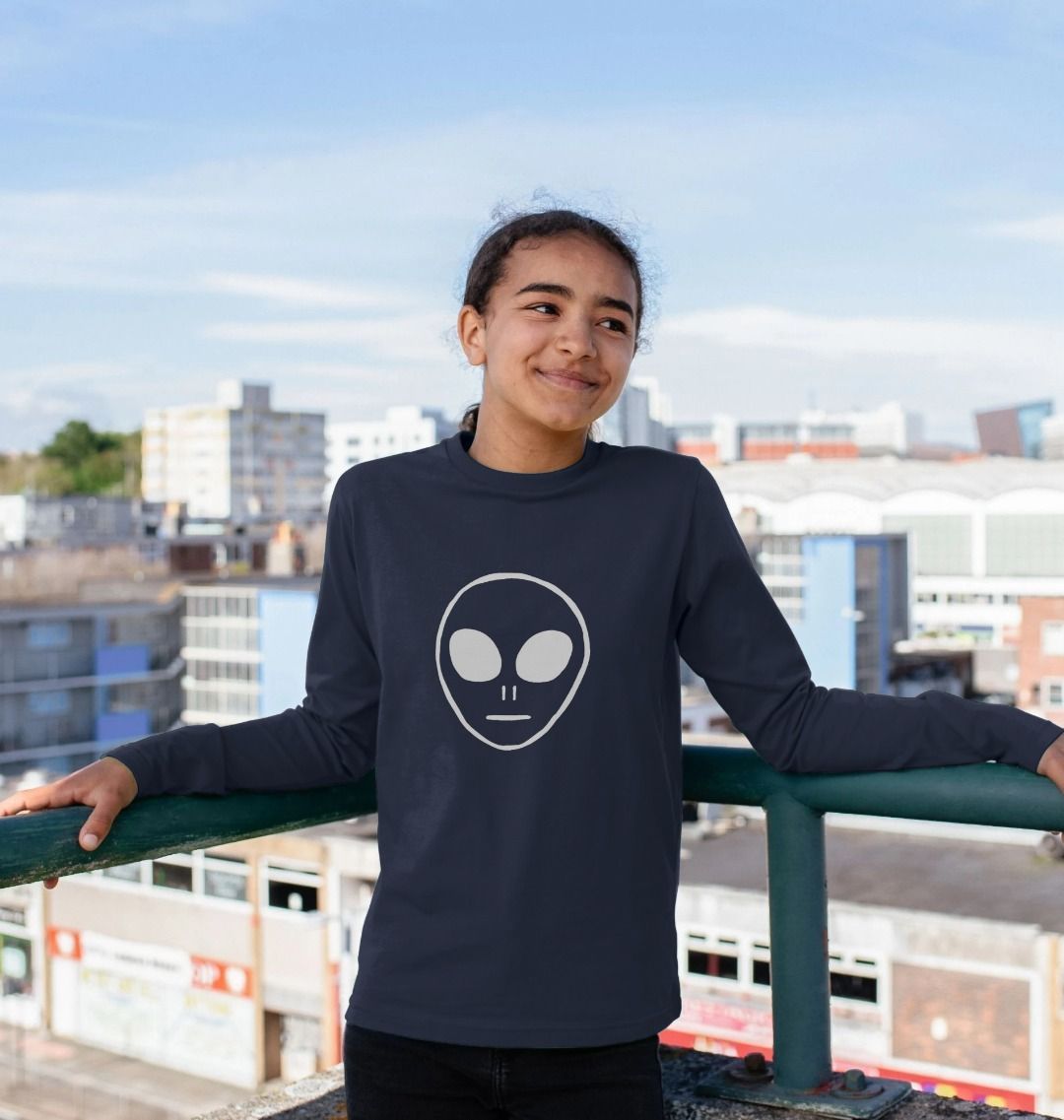 Navy blue long-sleeved t-shirt with alien face graphic (person)