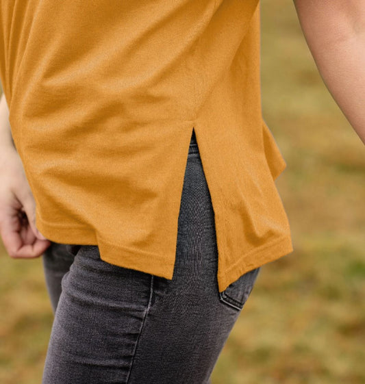 Mustard yellow t-shirt with side slits (person)