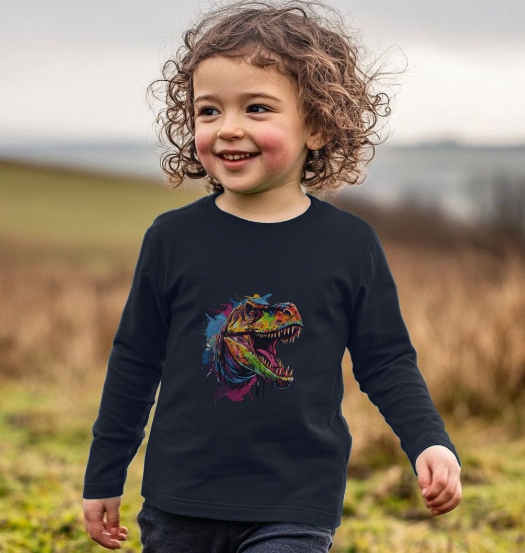 Toddler wearing black long-sleeve shirt with colorful dinosaur graphic (person)