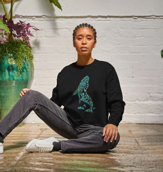 Black sweatshirt with green wolf design (person)